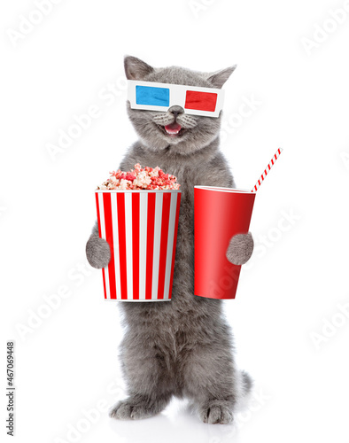 Happy cat wearing 3d glasses holds basket of popcorn and and cola. isolated on white background