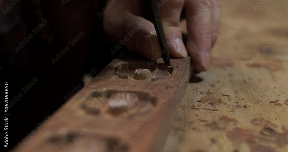 Close up of Chinese style carpenter carving on wood making traditional asian style furniture Close up of Chinese style carpenter carving on wood making traditional asian style furniture