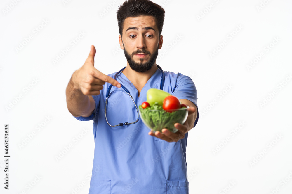 male doctor plate with vegetables healthy food nutritionist male doctor plate with vegetables healthy food nutritionist