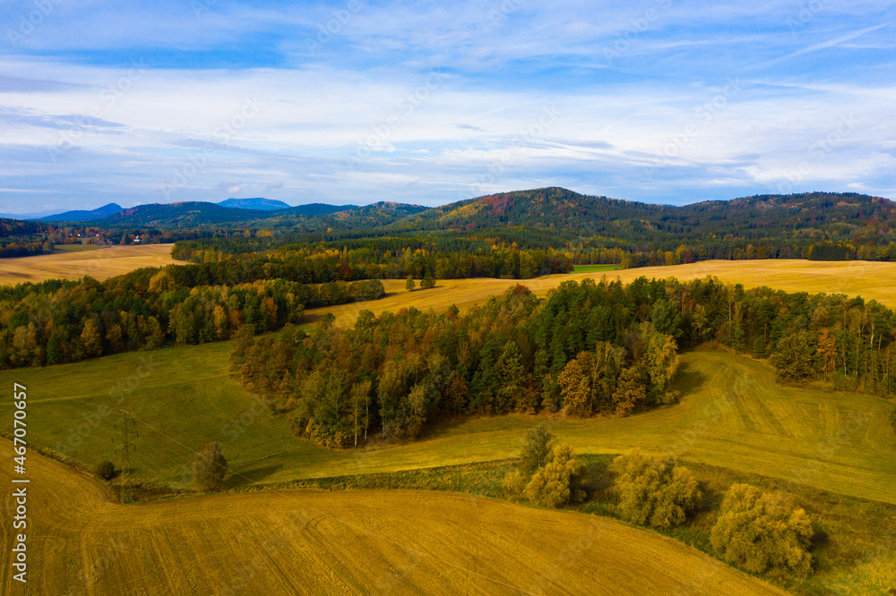 Panoramic countryside autumn view of hills and fields