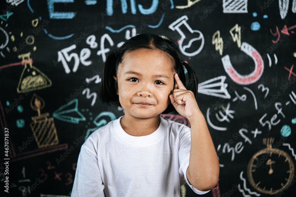 Portrait lovely girl front of education blackboard in background Portrait lovely girl front of education blackboard in background