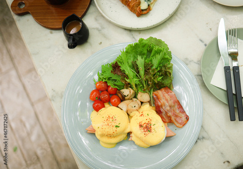 Breakfast Eggs Benedict toasted English muffins. Delicious breakfast with eggs Benedict