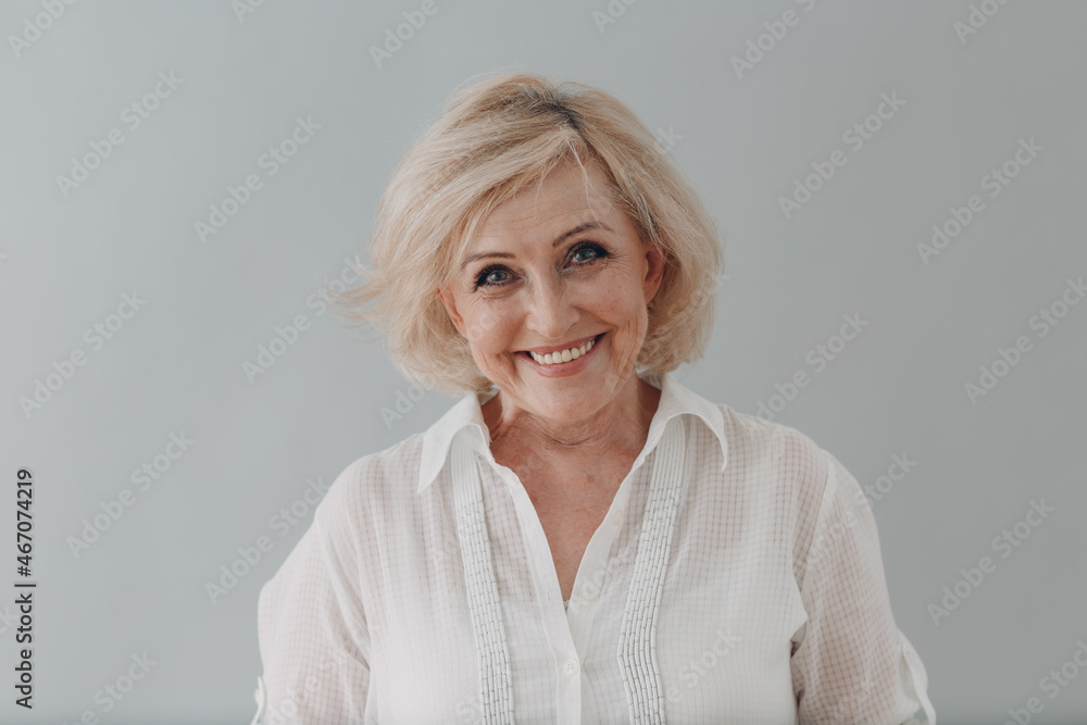 Elderly caucasian old aged woman portrait gray haired smiling portrait. Concept of affordable dentures and implants - obrazy, fototapety, plakaty 
