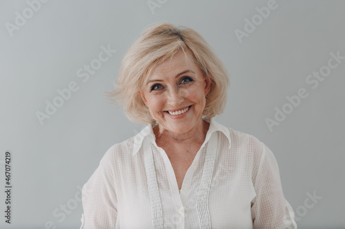 Fototapeta Elderly caucasian old aged woman portrait gray haired smiling portrait