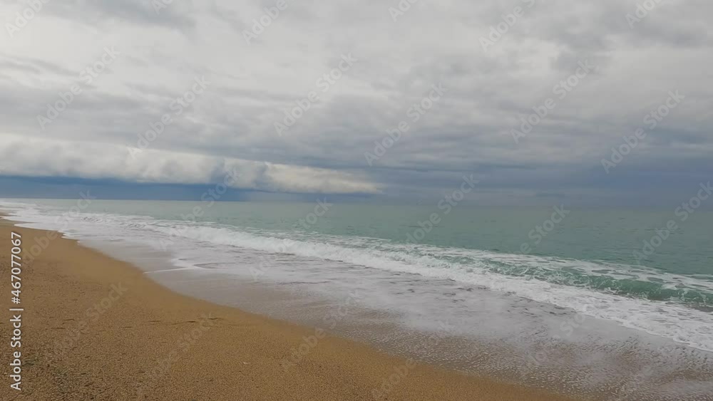 Coarse sand beach sea wave in slow motion at 120fps 4k cloudy day turquoise water single sea waves Big empty beach Coarse sand beach sea wave in slow motion at 120fps 4k cloudy day turquoise water single sea waves Big empty beach
