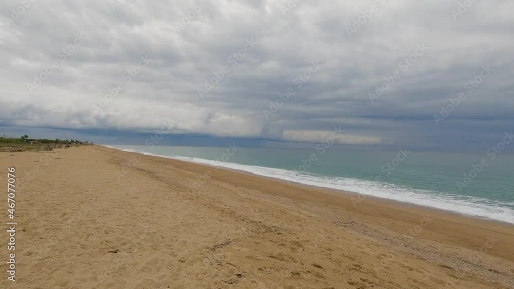 Coarse sand beach sea wave in slow motion at 120fps 4k cloudy day turquoise water single sea waves Big empty beach Coarse sand beach sea wave in slow motion at 120fps 4k cloudy day turquoise water single sea waves Big empty beach