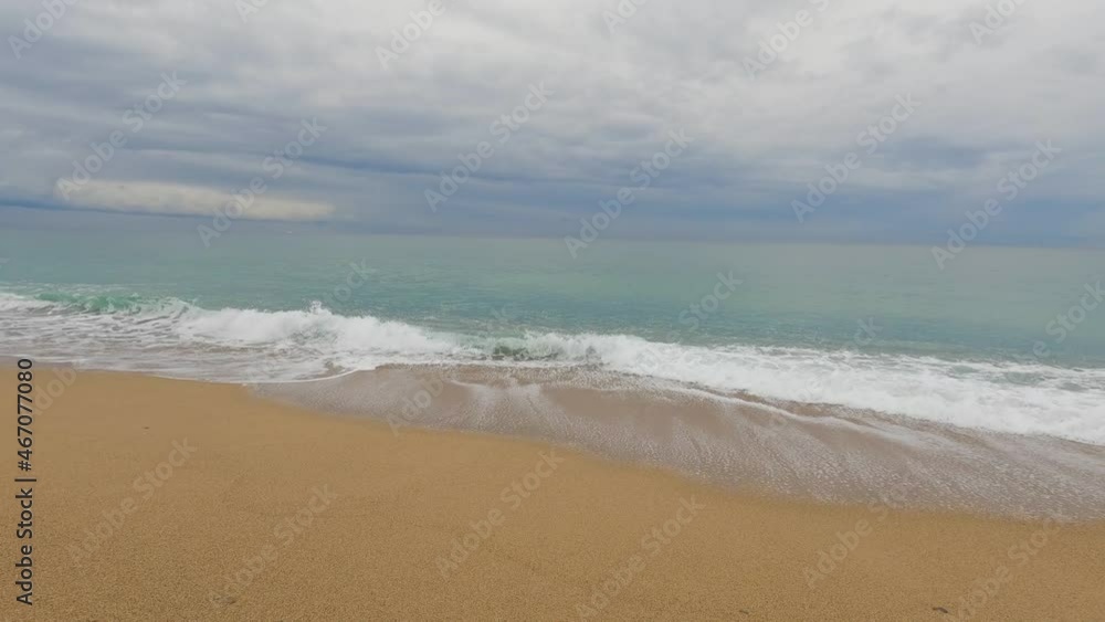 Coarse sand beach sea wave in slow motion at 120fps 4k cloudy day turquoise water single sea waves Big empty beach Coarse sand beach sea wave in slow motion at 120fps 4k cloudy day turquoise water single sea waves Big empty beach