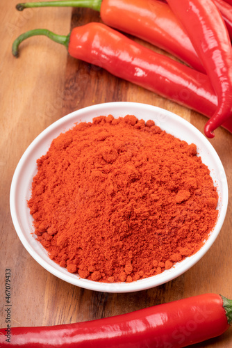 Korean pepper and red pepper in wooden plate, Korean chili powder on a wooden table background.