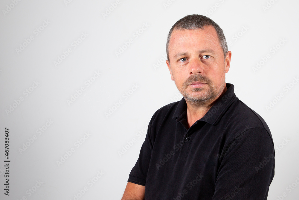 Portrait handsome of serious arms crossed mature man on grey background Portrait handsome of serious arms crossed mature man on grey background