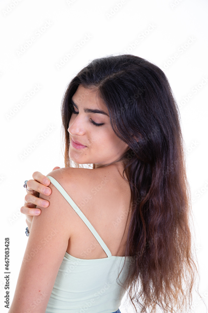 beautiful young woman looks over her shoulder with happiness and closed eyes face on white background beautiful young woman looks over her shoulder with happiness and closed eyes face on white background