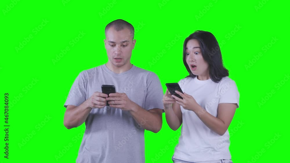 Happy couple playing games on mobile phone Happy couple playing games on mobile phone
