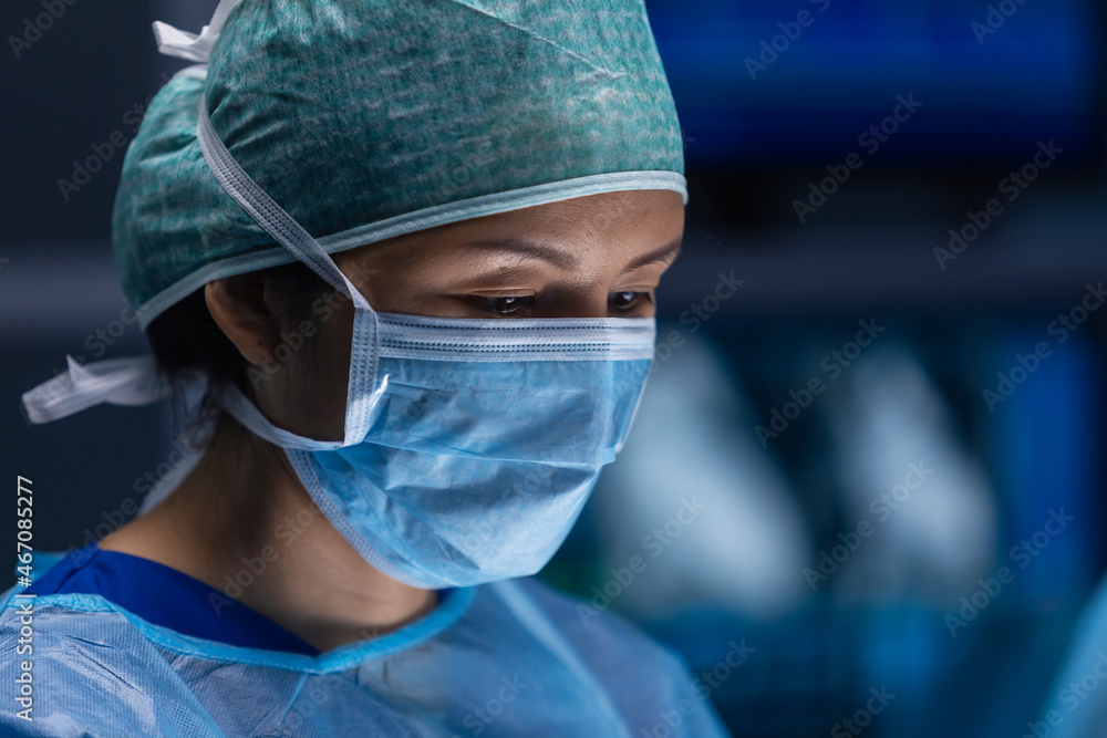 Multiracial team of professional medical surgeons performs the surgical operation in a modern hospital. Doctors are working to save the patient. Medicine, health, cardiology and transplantation. Multiracial team of professional medical surgeons performs the surgical operation in a modern hospital. Doctors are working to save the patient. Medicine, health, cardiology and transplantation.