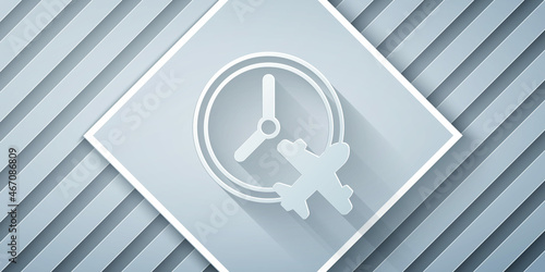 Paper cut Clock with airplane icon isolated on grey background. Designation of time before departure, check-in for flight and arrival time symbol. Paper art style. Vector