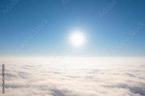 Aerial view white clouds in blue sky. View from drone. Aerial top view cloudscape. Texture of clouds. View from above. Panorama sky