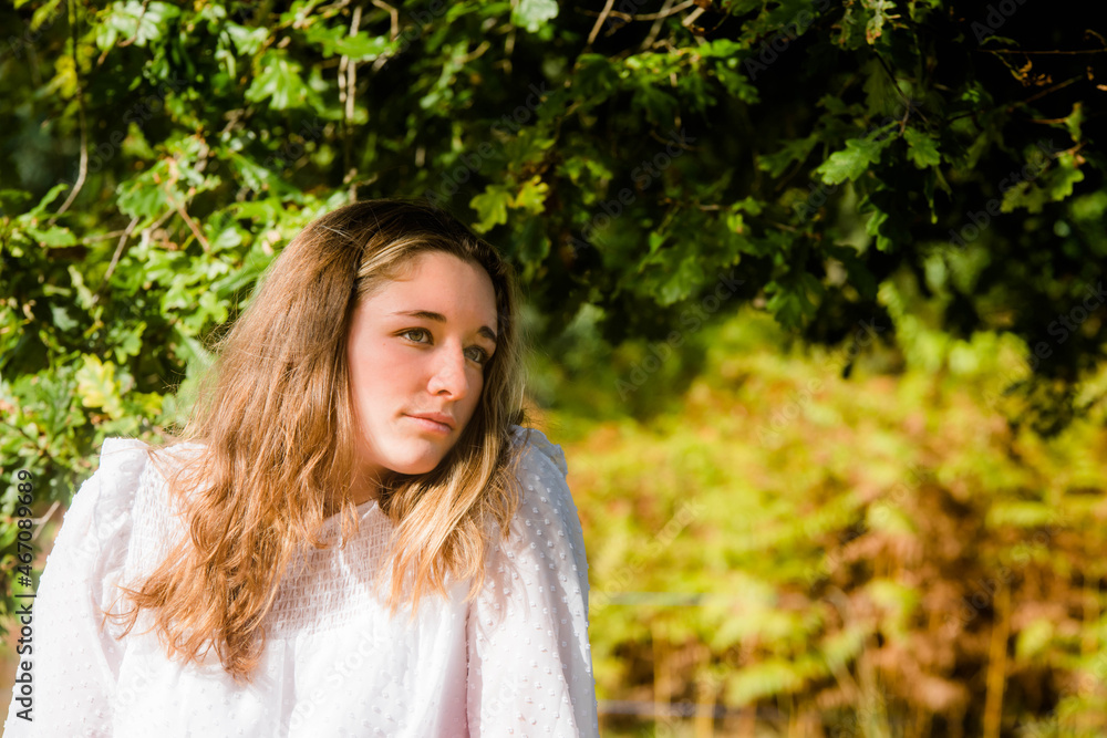 portrait of a beautiful young woman in an autumnal landscape portrait of a beautiful young woman in an autumnal landscape