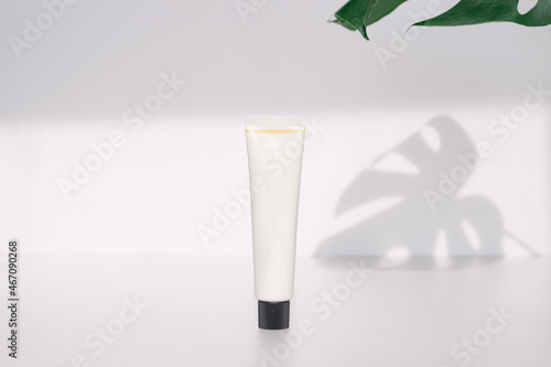 Wallpaper Mural A white tube-type cosmetics container with a black lid. Torontodigital.ca