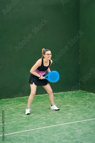 Glad sportswoman ready to play padel © JoseIMartin