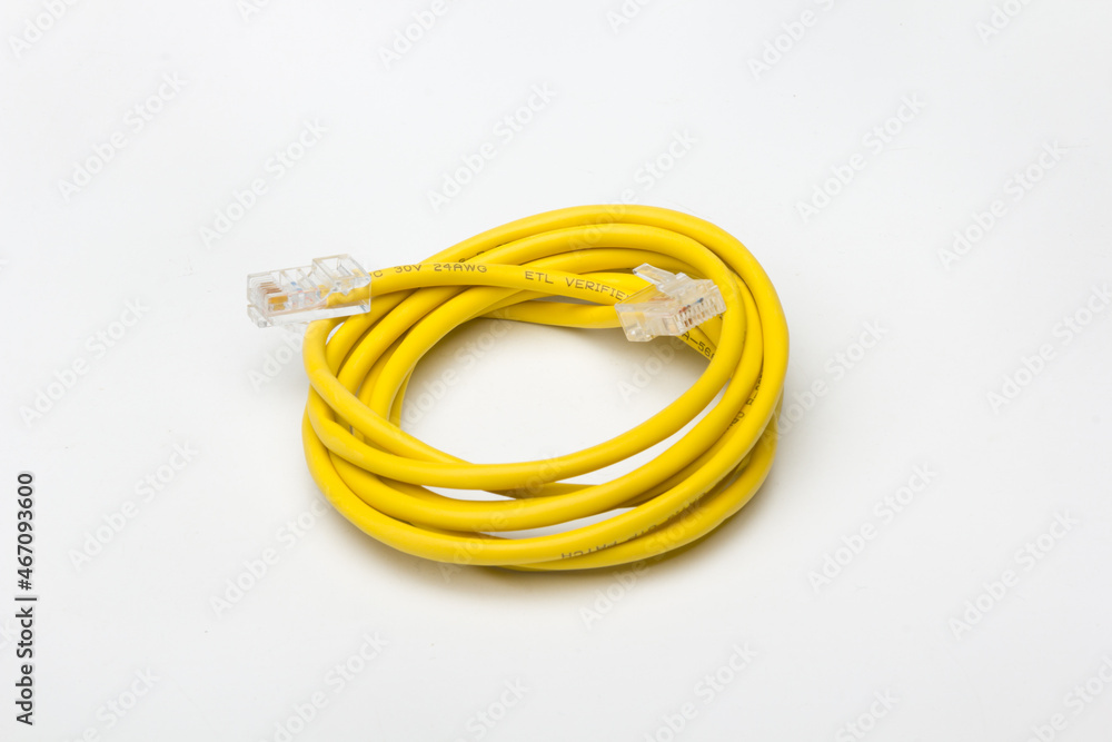 yellow communications cable, coiled to create a circle yellow communications cable, coiled to create a circle