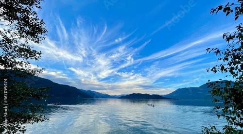 Harrison Lake with people kayaking and rowing, British Columbia, Canada photo