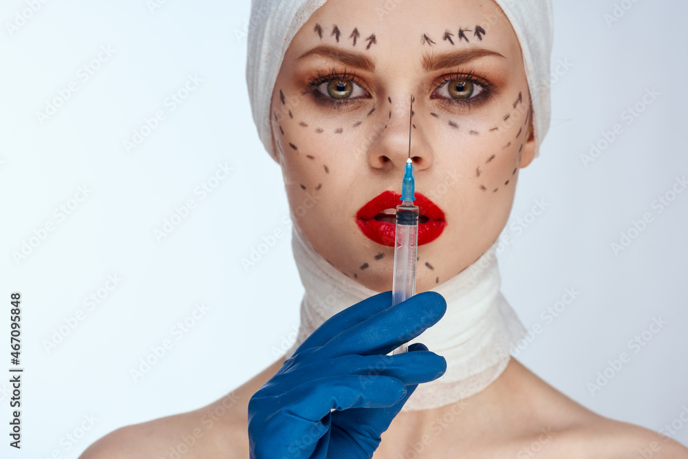portrait of a woman in blue gloves syringe in hands contour on the face lifting studio lifestyle portrait of a woman in blue gloves syringe in hands contour on the face lifting studio lifestyle