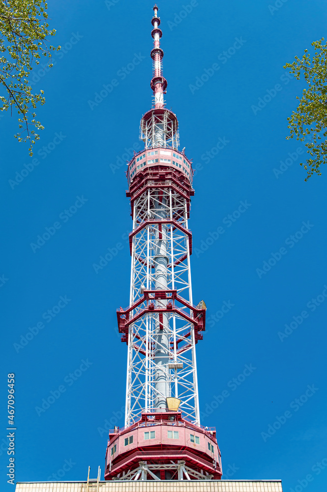 TV tower in the city of Kiev. Radio signal transmission. Public television.  Wireless internet. Modern technologies. Industrial construction. The media.  City life. Stock Photo | Adobe Stock