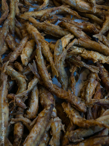 fried small sea fish. fried capelin on the counter of the store  