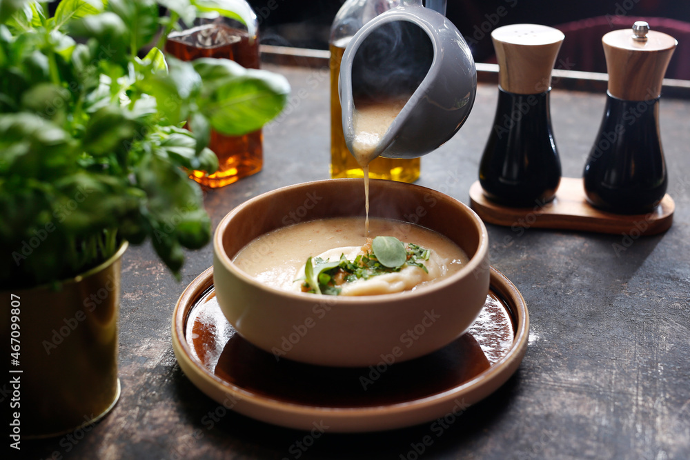 Mushroom cream soup with dumplings. A warming soup.
A tasty dish.Culinary photography. Suggestion to serve the dish. Mushroom cream soup with dumplings. A warming soup.
A tasty dish.Culinary photography. Suggestion to serve the dish.