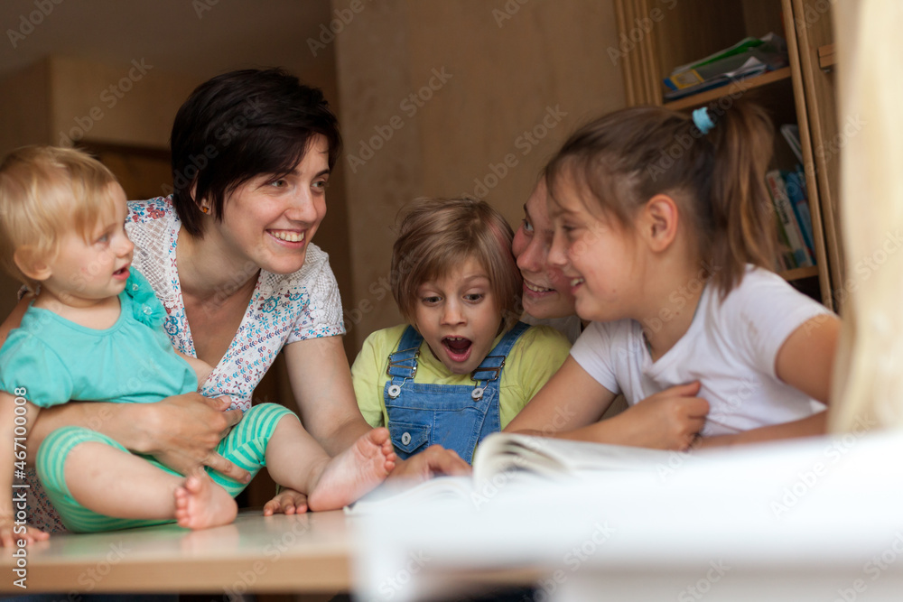 Smiling children of different ages from 2 to 14 years old with mother Smiling children of different ages from 2 to 14 years old with mother
