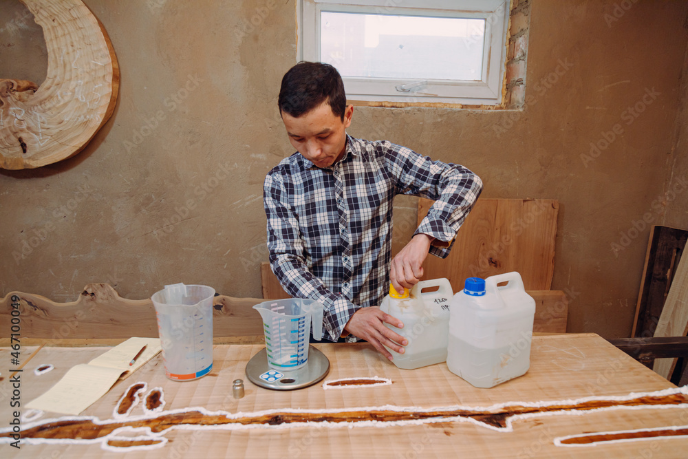 Carpenter preparing epoxy resin Carpenter preparing epoxy resin