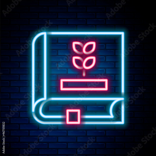 Glowing neon line Book about seeds icon isolated on brick wall background. Colorful outline concept. Vector