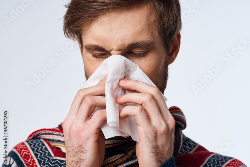 Murais de parede sick man with a handkerchief health problem flu symptoms light background