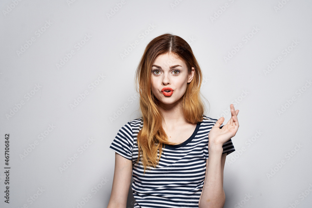 beautiful woman holding hair makeup posing fun fashion expression light background beautiful woman holding hair makeup posing fun fashion expression light background