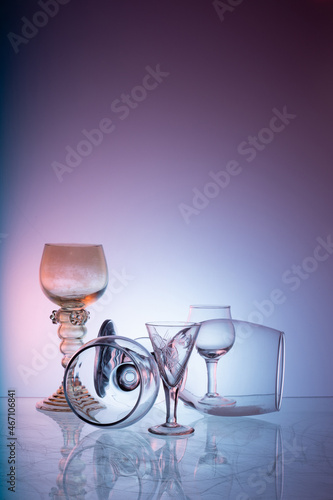 Glassware on abstract diffuse background in pink blue tones