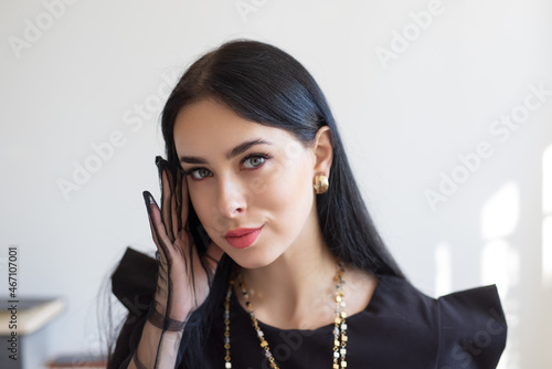 Portrait of elegant intelligent woman in lace gloves