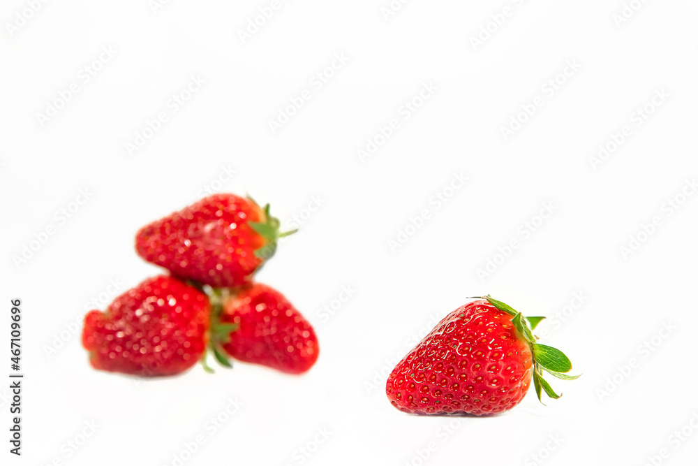 freshly picked organic strawberry isolated over white background, healthy eating. freshly picked organic strawberry isolated over white background, healthy eating.