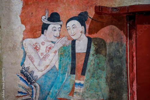 Famous Buddha temple in Nan town, Thailand is Wat Phumin. Wat Phumin is famous wall paining inside temple of the “whispering” two lovers mural. photo