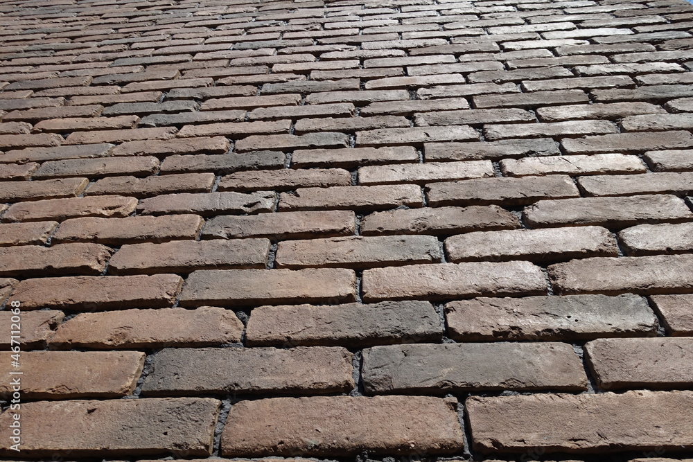 Close view of wall made of brown brick veneers