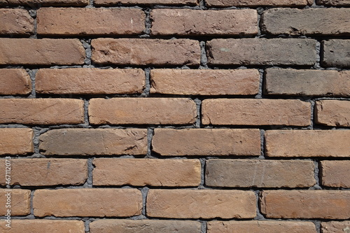 Texture of wall made of brown brick veneers