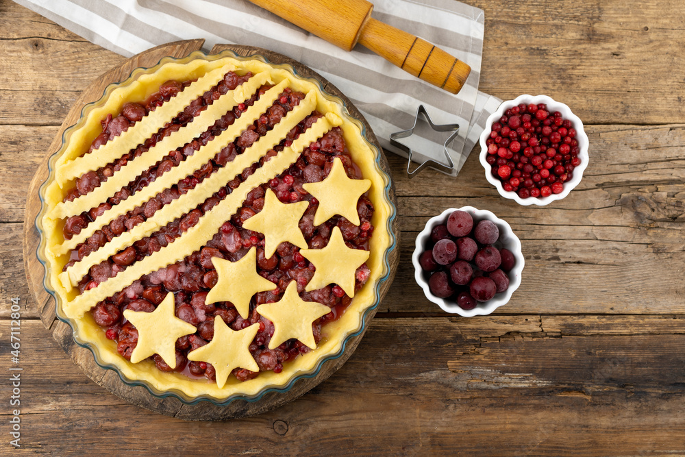 Step 3. Before baking. Homemade cherry pie. Homemade product made from dough with stars. Food for 4th July USA Independence Day. American Pie. Sweet pastries. Berry open round tart. Step 3. Before baking. Homemade cherry pie. Homemade product made from dough with stars. Food for 4th July USA Independence Day. American Pie. Sweet pastries. Berry open round tart.