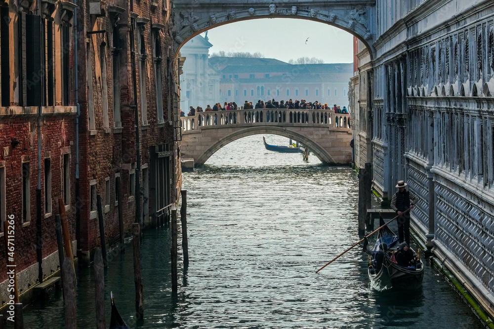 A gondola passes under the Bridge of Sighs in Venice