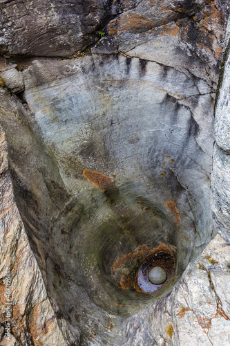 Cavaglia, Switzerland - October 30, 2021 : Glacier Mills or Giants pots in Cavaglia Glacier garden. photo