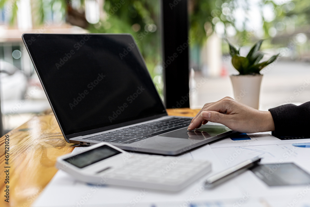 A business women working in a private room, She is typing on a laptop keyboard, She uses a messenger to chat with a partner. Concept of using technology in communication. A business women working in a private room, She is typing on a laptop keyboard, She uses a messenger to chat with a partner. Concept of using technology in communication.