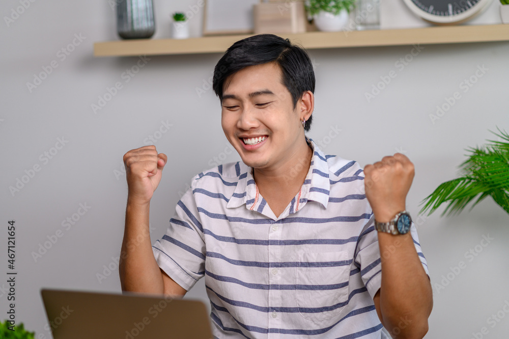 male employee working in office with laptop male employee working in office with laptop
