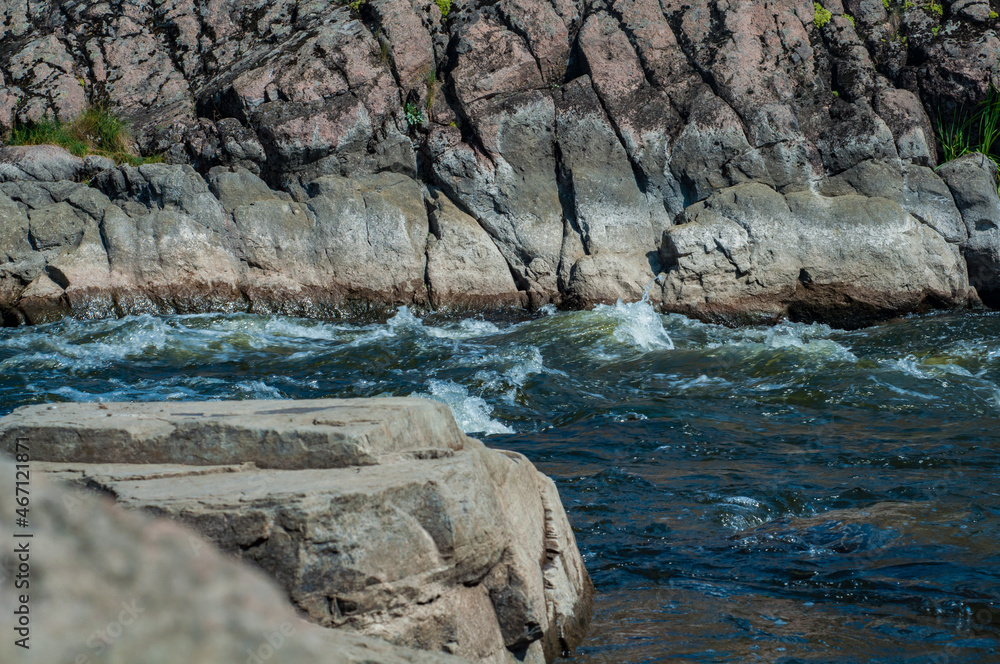 Landscape panorama. Fast cold water mountain stream, stormy water flow, outdoor nature, fresh stream, dark blue water