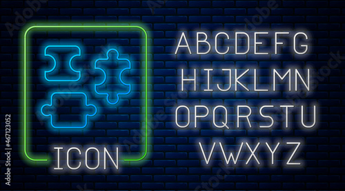 Glowing neon Puzzle pieces toy icon isolated on brick wall background. Neon light alphabet. Vector