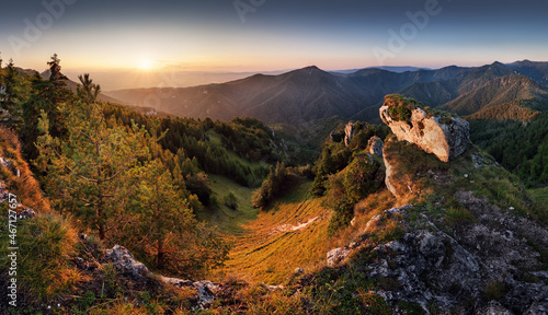 Forest and rocks mountain with sun at beautifull sunset - panorama, Slovakia