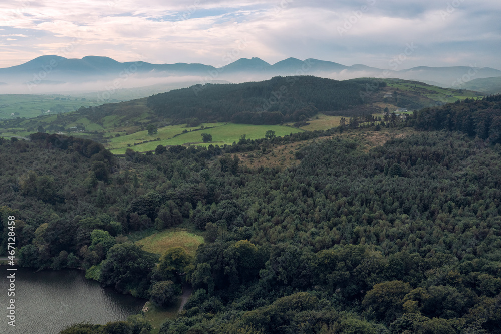 aerial view Castlewellan forest park during foggy summer morning, Northern Ireland