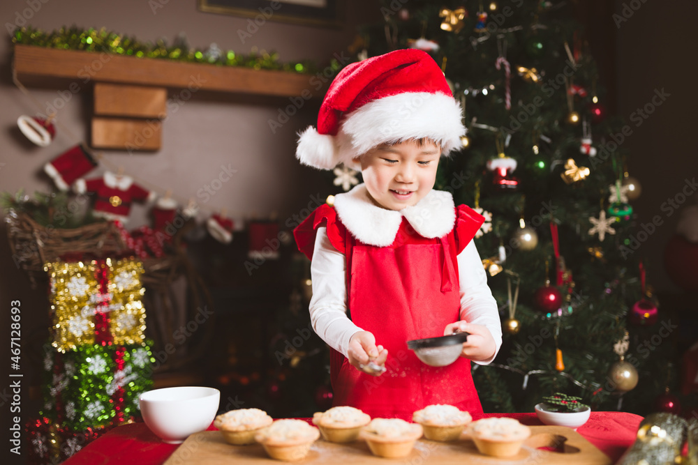 young girl preparing mince pie for celebrating Christmas party young girl preparing mince pie for celebrating Christmas party