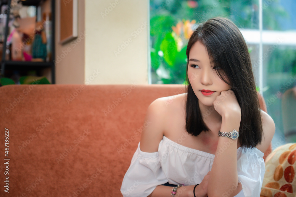 Portrait of young Asian beautiful cute girl in cafe, lifestyle concept Portrait of young Asian beautiful cute girl in cafe, lifestyle concept