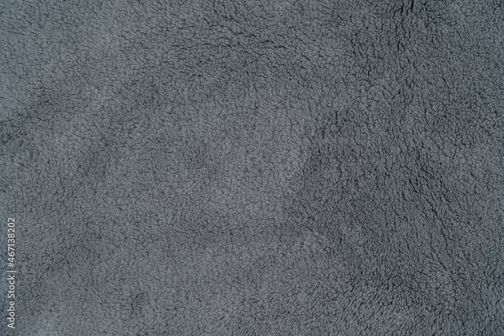 Gray sherpa textured plush fabric material for a background or